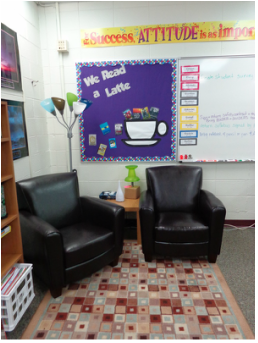 Reading corner with two chairs and bulletin board.